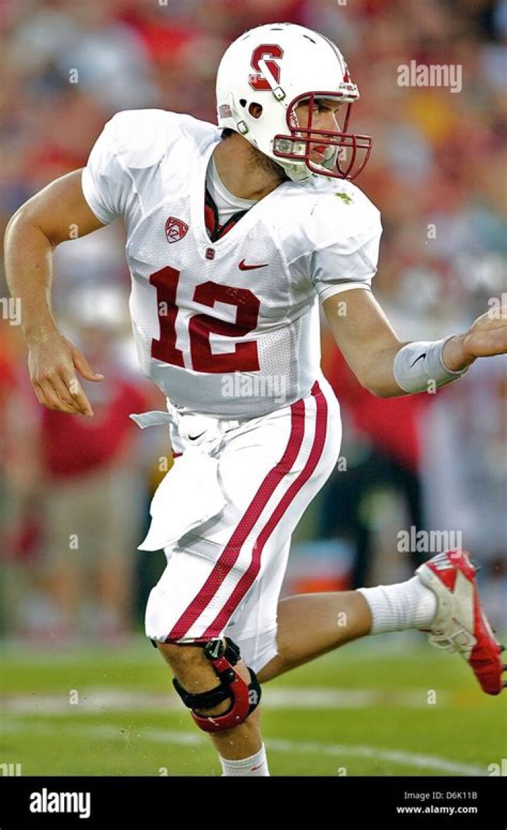 2011 Stanford QB Andrew Luck hands the football off in a highly
