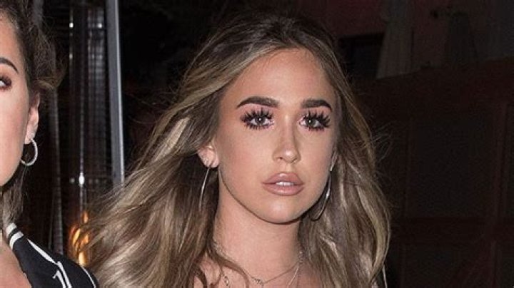 Ariana Biermann Rocks A Tiny Bikini & Staddles A Surfboard While In