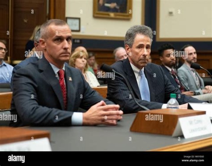 Attorney Peter Chavkin, right, takes a seat at the witness table with