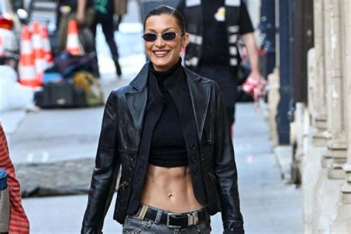 Bella Hadid shows off her toned abs in lowrise green cargo pants as