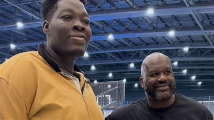 Big meets small Basketball legend Shaquille O'Neal dwarfs gymnast