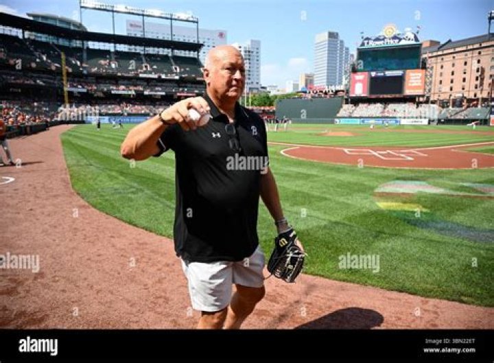 Former Baltimore Orioles player Cal Ripken, left, smiles for a photo
