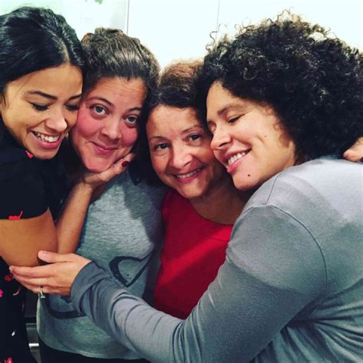Gina Rodriguez and Her Sister Walking Hand in Hand Behind the Scenes