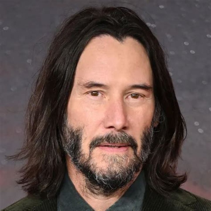 Keanu Reeves from 'The Matrix' Poses on Red Carpet with His Beautiful
