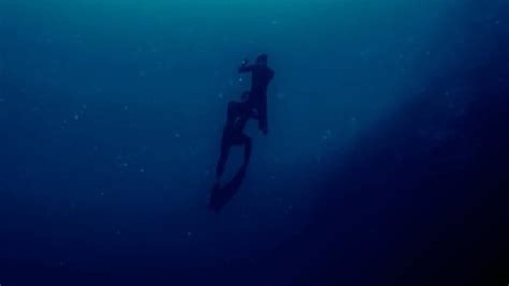 Last image of free diver Stephen Keenan (bottom diver) rescuing Alessia