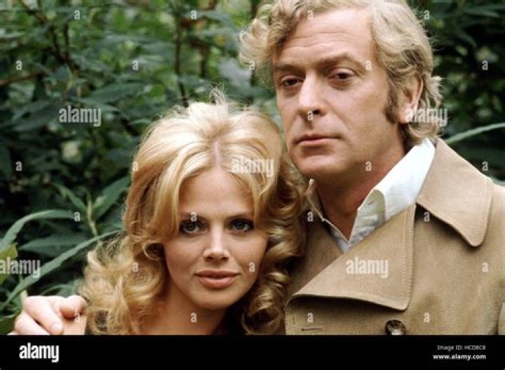 Michael Caine and Britt Ekland, are seen during a break in the filming