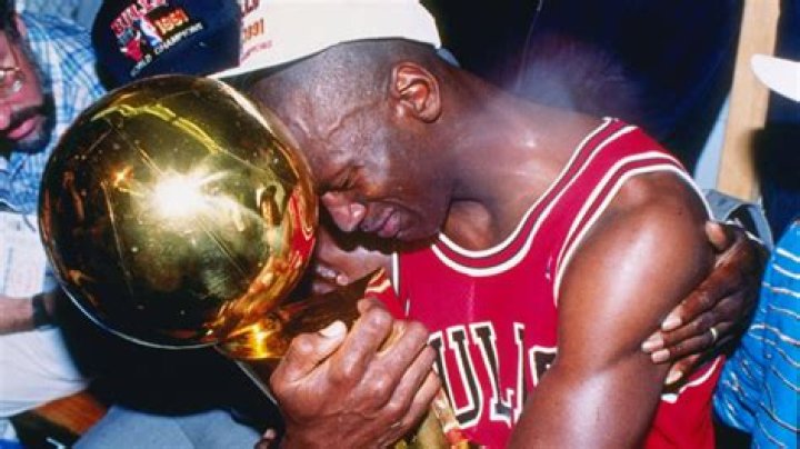 Michael Jordan holding the first Bull's Championship Trophy in 1991