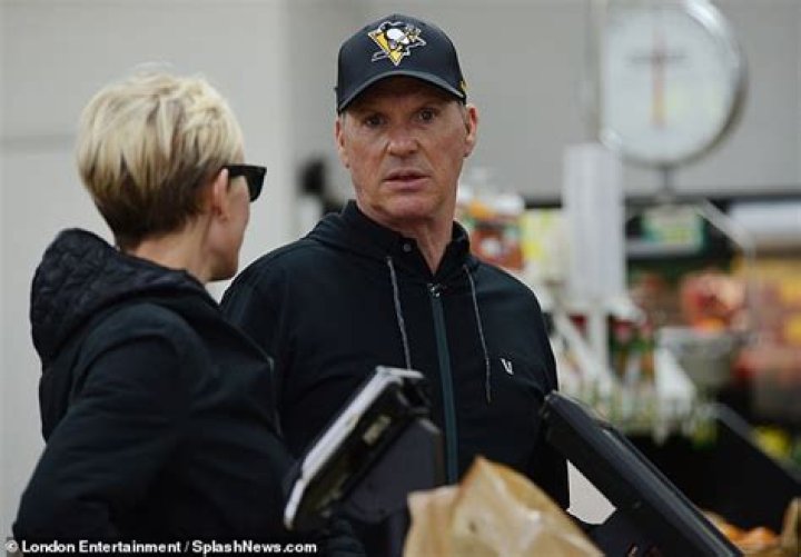 Michael Keaton, 68, looks cheery as he stocks up on groceries with his
