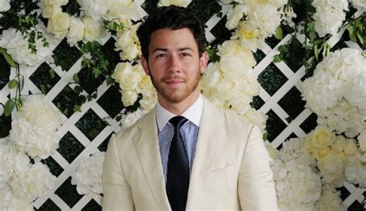 Nick Jonas Revamps Linen with Brown Leather Boots at Wimbledon 2023