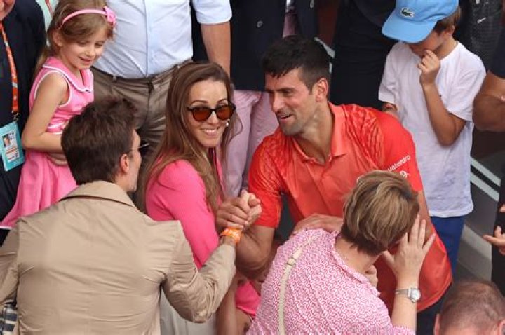 Novak Djokovic hugs Tom Brady after winning French Open