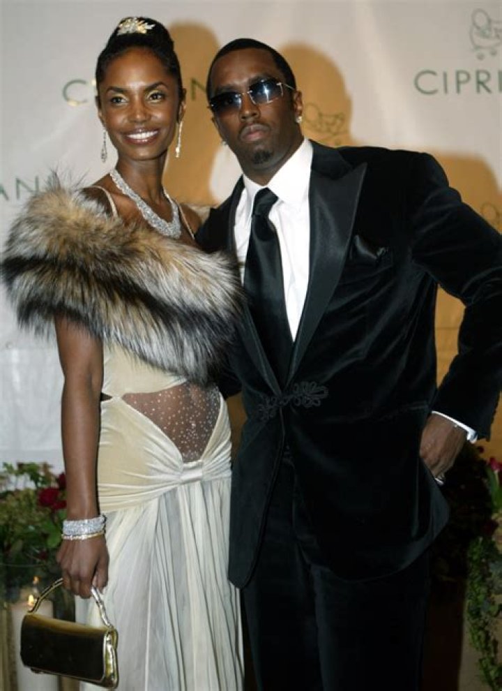 Photo Kim Porter, P. Diddy et leur fils Christian en 2004 Purepeople