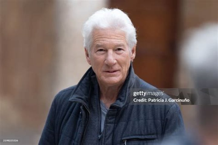 richard gere poses next to a huge gerbil, highly Stable Diffusion