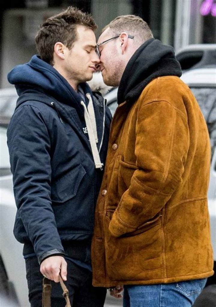 Sam Smith and Brandon Flynn Share a Kiss in NYC