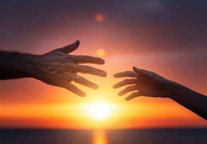 Sunset with hands reaching out