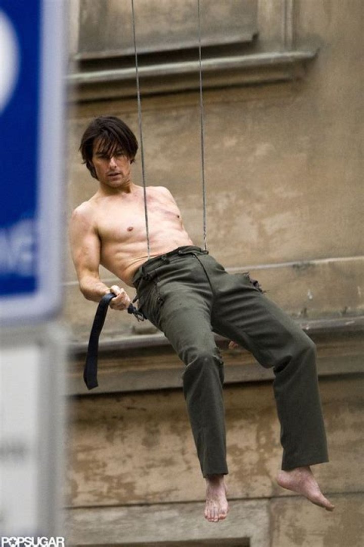 Tom Cruise was shirtless, dangling from a building for the filming of