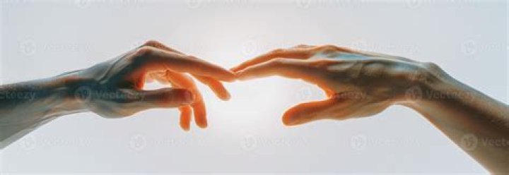 Two human hands reaching towards each other Vector Image