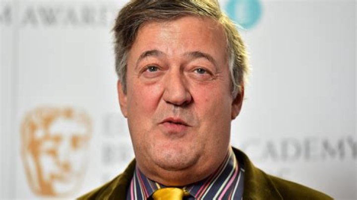 Who is Stephen Fry's husband Elliott Spencer and how old is he